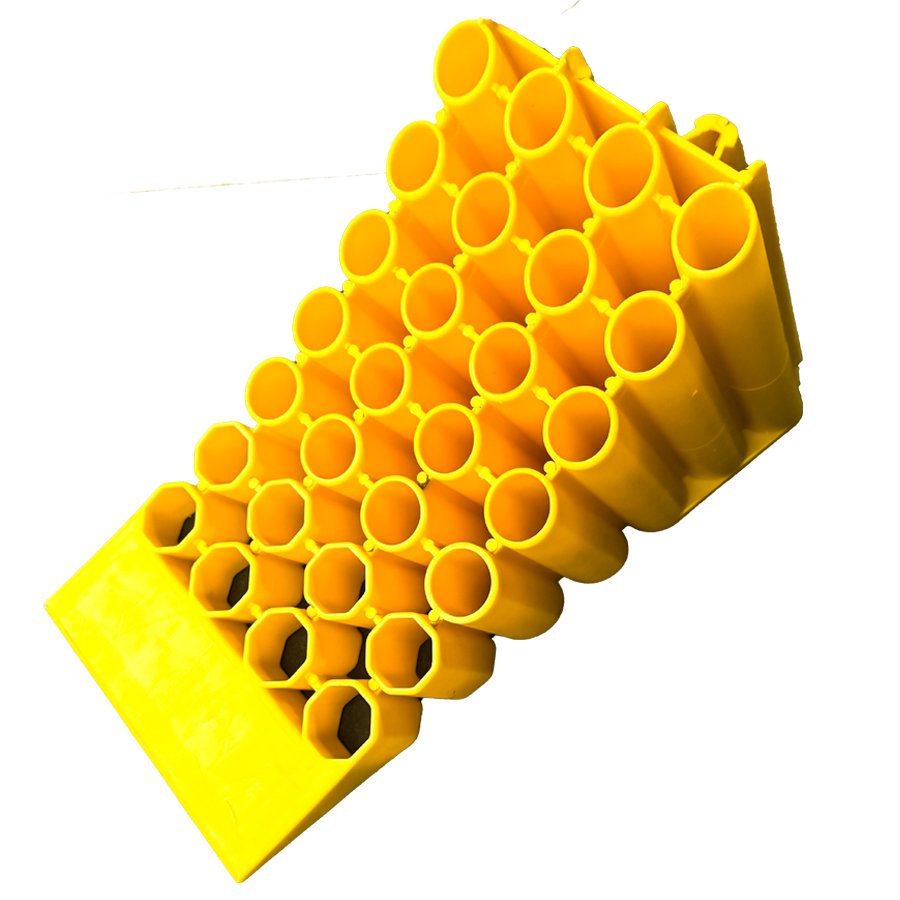 a yellow object with many holes